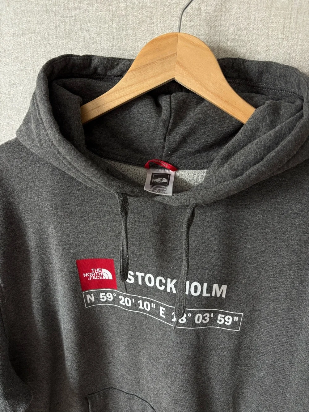 The North Face Men’s Stockholm Hoodie in Charcoal Gray with Red Logo